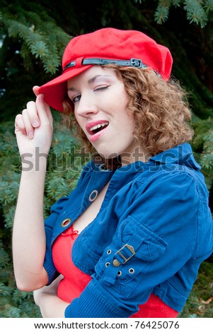 beautiful young woman in a cap of red