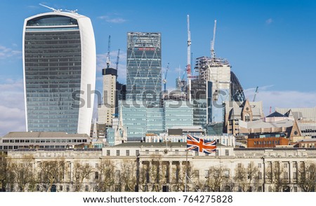 City of London, UK with Union Jack on foreground