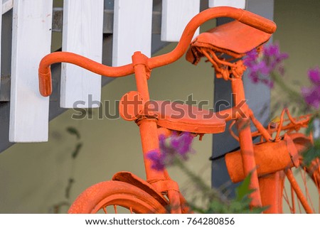 steering wheel and seat, orange Bicycle closeup