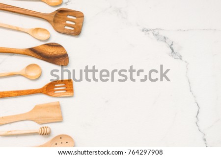 Kitchen utensils with copy space on white marble stone background