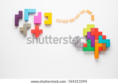 Human brain is made of multi-colored wooden blocks. Creative medical or business concept. Logical tasks. Conundrum, find the missing piece of the proposed. Royalty-Free Stock Photo #764313394