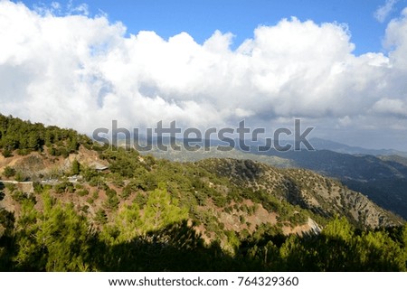 Landscape of Troodos mountains from Cyprus and cloudy blue sky 