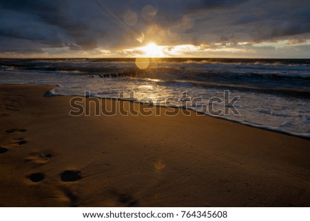 Sundown coast of Baltic sea  with bokeh during a rain