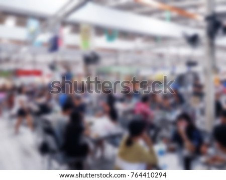 Blurred background people enjoy eating at food cafeteria or foods center in departmentstore.