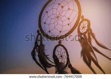 Dream catcher in the wind with beautiful  sunset, Ethnic amulet