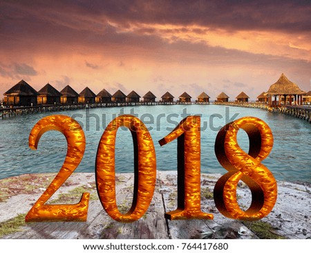 New Year inscription 2018 on the wooden road over the sea