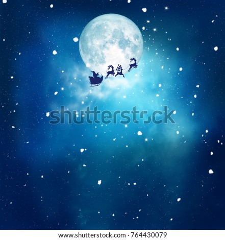 Merry christmas and happy new year greeting card with copy-space. Winter christmas night landscape.Santa and his sleigh flying over snowy landscape 