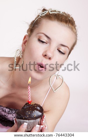 Picture of pretty young woman with chocolate birthday cake