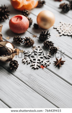 wooden snowflake and fur-tree toys . christmas background.bumps and candles