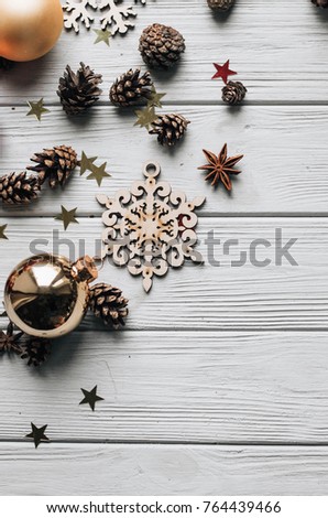 wooden snowflake and fur-tree toys . christmas background.bumps and candles