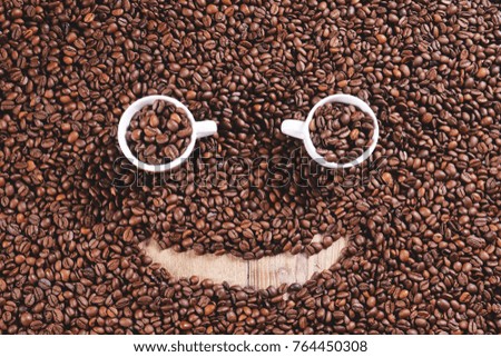 Top view of a smoky-shaped coffee texture on wooden background.Good quality coffee still hot and steaming. Concept of: relaxation, aroma and perfumes, brazilian and italian