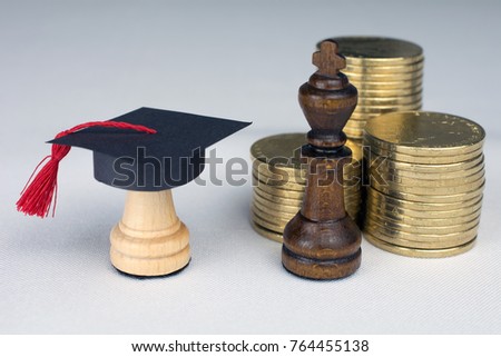 white chess piece in a graduation cap on white background, education concept close up, selective focus