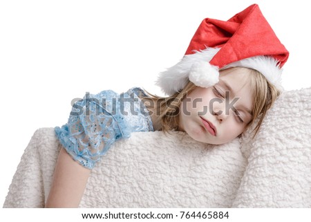 7-years old girl sleeping in Sleeping Beauty dress and Santa hat.