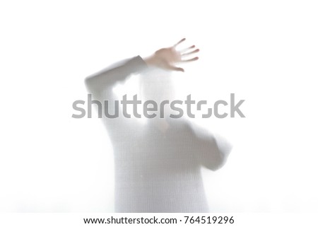 Man behind the opaque glass, look like ghost