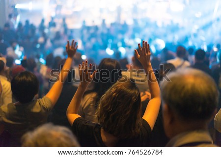 Christian worship with raised hand and pray in the worship concert. Royalty-Free Stock Photo #764526784