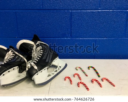 Hockey skates with candy canes in locker room 