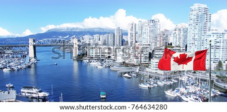 Canadian flag in front of view of False Creek and the Burrard street bridge in Vancouver, Canada. 