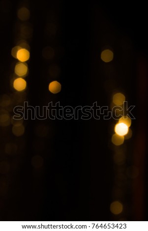 Blurred bokeh lights in the dark background. Christmas concept