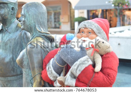 Close up of joyful traditional Santa Claus - icon of the happy festive time, seasonal outdoors background. Jolly portrait photo