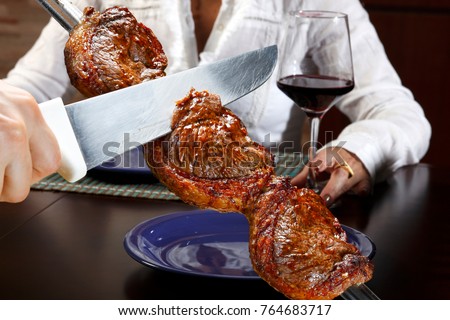 Brazilian steakhouse, specializing in meat steak, especially picanha Royalty-Free Stock Photo #764683717