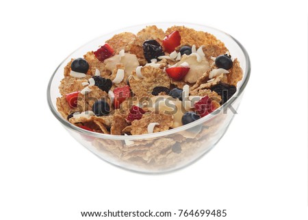 Homemade granola in a transparent plate. Cereals for milk or yogurt with blueberries, strawberries and nuts Picture to illustrate a healthy lifestyle or Breakfast, isolated on white background.
