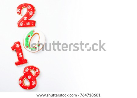 Christmas gingerbread cookies 2018 on white background with copy space for text. Holiday, celebration and cooking concept. Merry Christmas postcard