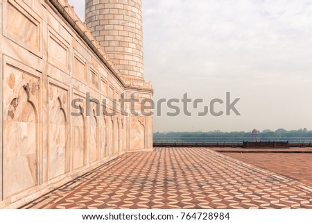 Wide angle picture of beautiful marble wall and floor of Taj Mahal, landmark of India located in Agra, Uttar Pradesh.
