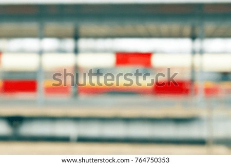 Blurred background of perspective railway and station platform, transportation concept