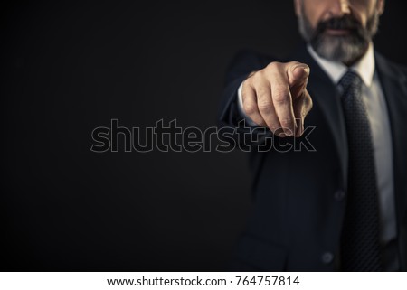 Angry senior man pointing his finger towards you, accusing and blaming you for incompetence Royalty-Free Stock Photo #764757814