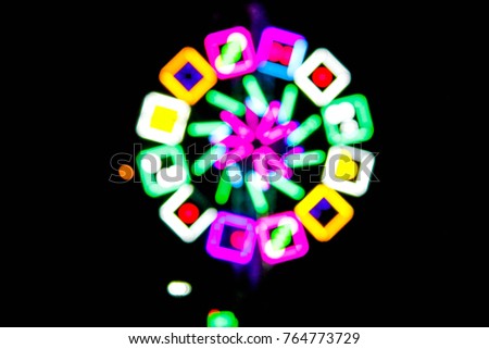 Abstract blurred multicolor neon light circle in party night for colorful background,pattern ,texture with copy space.Rainbow light background,Night background.