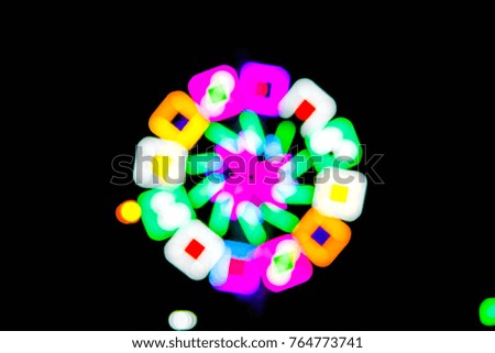 Abstract blurred multicolor neon light circle in party night for colorful background,pattern ,texture with copy space.Rainbow light background,Night background.