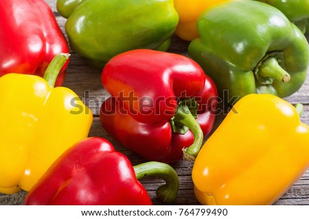 Colorful green , red and yellow peppers paprika background Royalty-Free Stock Photo #764799490