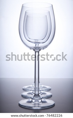 Three wine glasses isolated on a white background.