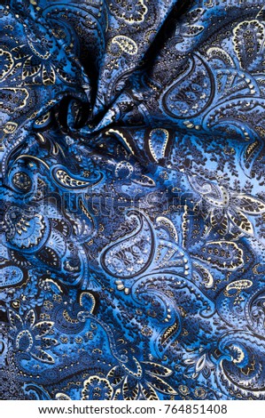 Background texture, Fabric blue paisley. Designed for Fabri-Quilt, this soft double napped  flannel is perfect for quilting, apparel, and home decor accents. Colors include black, blue, and white.