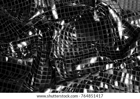 texture, background, pattern. Fabric with large paillettes of gray black. Like a binding paint mixed with a mirror effect, these gray reflective pale glitters are truly unique.