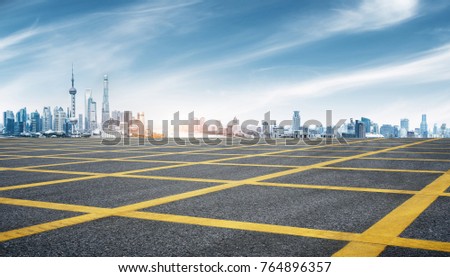 empty brick floor and cityscape of shanghai in blue sky