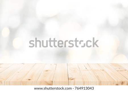 Wood table top on white bokeh abstract background and used for montage or display products
