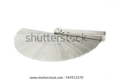 feeler gauge is a tool used to measure gap widths Royalty-Free Stock Photo #764913370