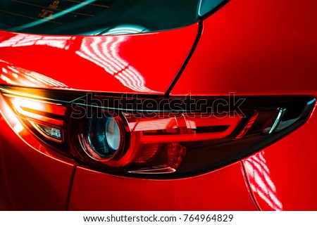 Car tail light red color for customers. Using wallpaper or background for transport and automotive image. Royalty-Free Stock Photo #764964829