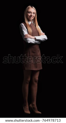 successful young business woman. isolated in the dark. photo in full growth
