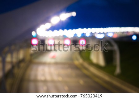 Blurred image background: Speed Traffic at Night Time - light trails on motorway empty highway at night, long exposure abstract urban background