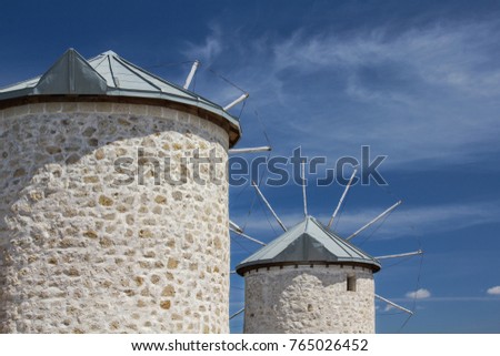 Traditional old windmills in Alaçat?, with cloudy blue sky, ?zmir province, Turkey.

