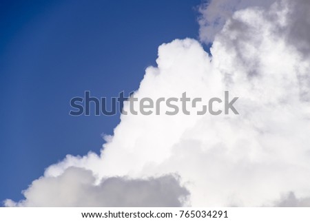 Cumulus clouds in the blue sky. Heavenly landscape. Photograph of the sky