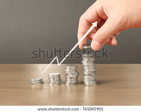 human hand putting coin to money, business ideas