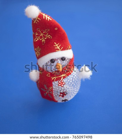 Snowman isolated on blue background