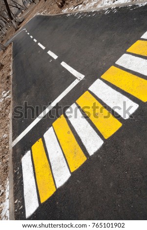 pedestrian markings on asphalt