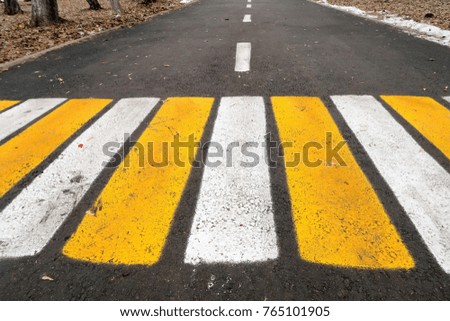 pedestrian markings on asphalt