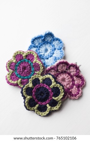 Knitted flowers on a white background