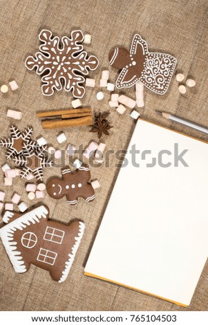  gingerbread, cinnamon, anise and notebook with pencil