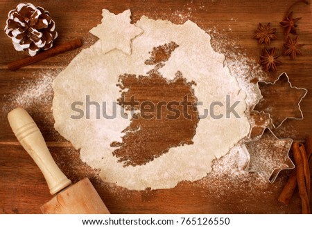 Festive cookie dough with the shape of Ireland cut out (series)